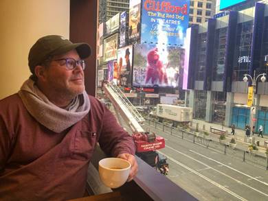 A picture containing text, person, person, outdoor Description automatically generated